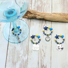 Load image into Gallery viewer, 4 Nubble Lighthouse Blue &amp; Yellow Wine Glass Charms
