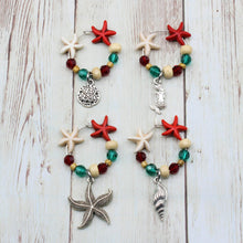 Load image into Gallery viewer, 4 Red &amp; Green Starfish Wine Charms for Christmas
