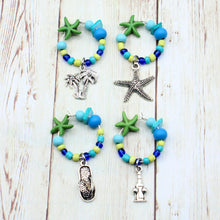 Load image into Gallery viewer, 4 Tropical Blue Green Starfish Wine Glass Charms
